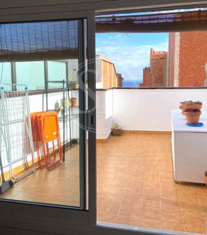 Ático con vistas al mar y a Montjuic